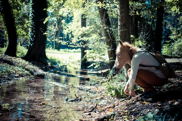 Young hipster horse mask woman in autumn — Stock Photo, Image