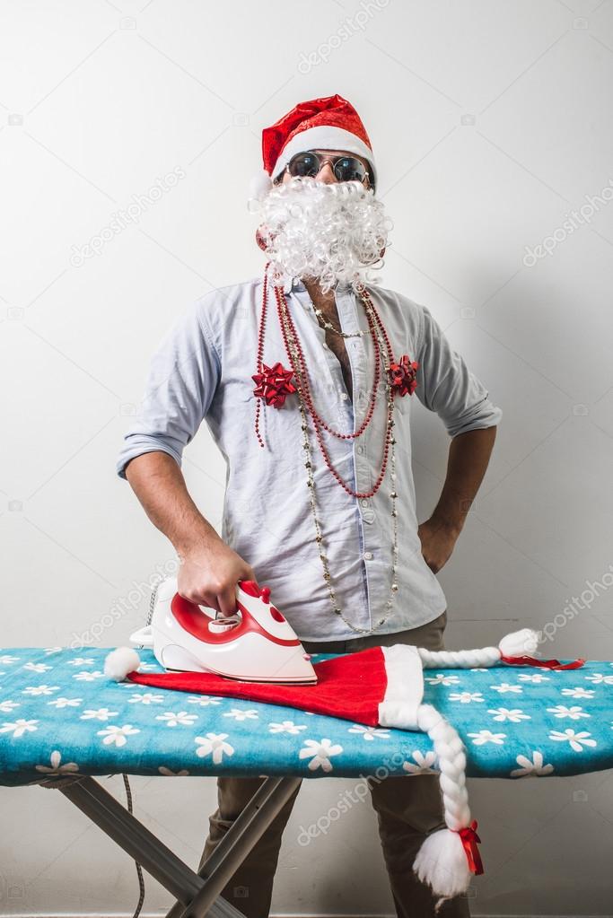 funny santa claus babbo natale ironing