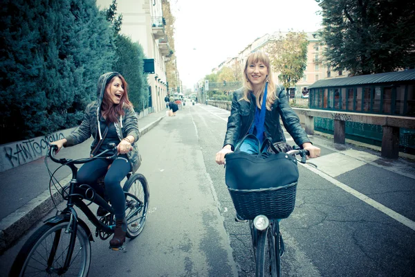 Two friends woman on bike — Stock Photo, Image