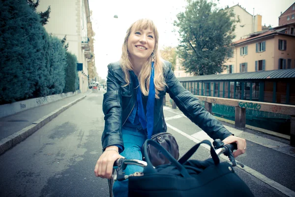 Beautiful blonde woman on bike — Stock Photo, Image