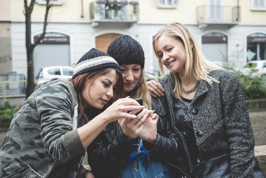 three friends woman on the phone