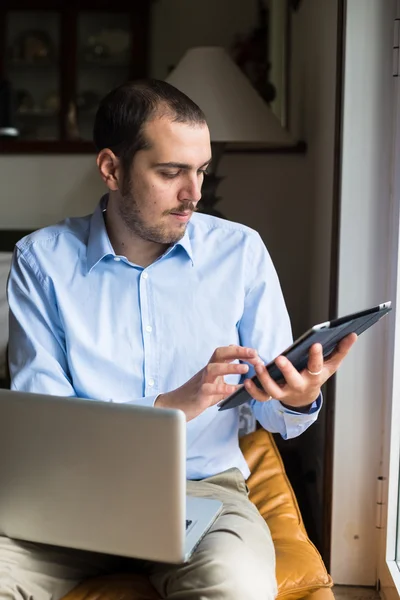 Elegant business multitasking multimedia man at home — Stock Photo, Image
