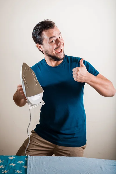 Young stylish man housewife ironing — Stock Photo, Image