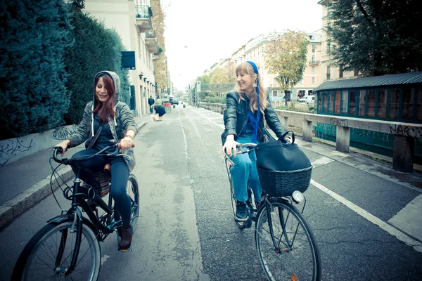 Two friends woman on bike — Stock Photo, Image