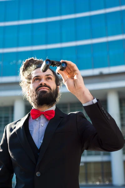 Stylish elegant dreadlocks businessman binoculars — Stock Photo, Image