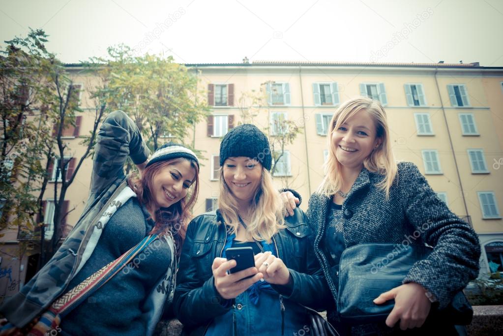 three friends woman on the phone