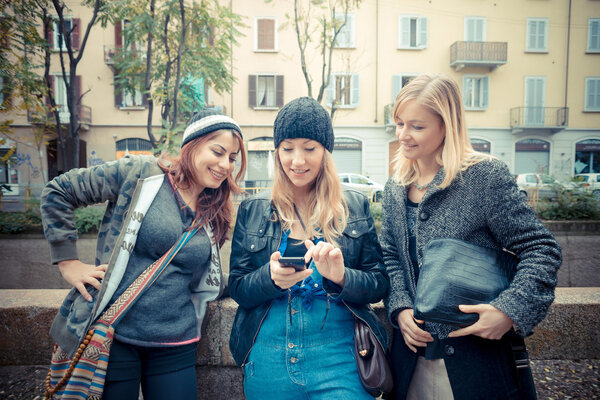 three friends woman on the phone