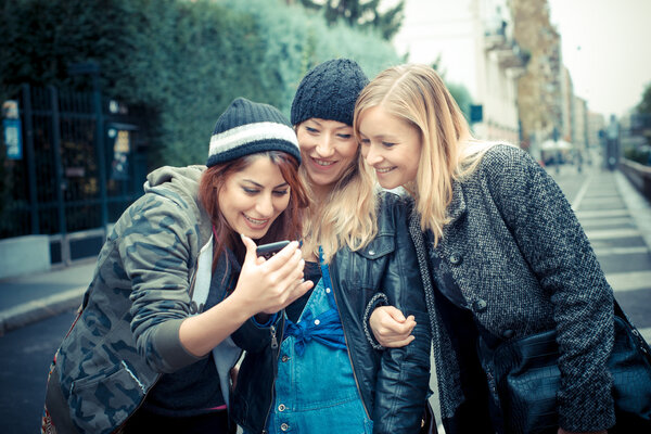three friends woman on the phone
