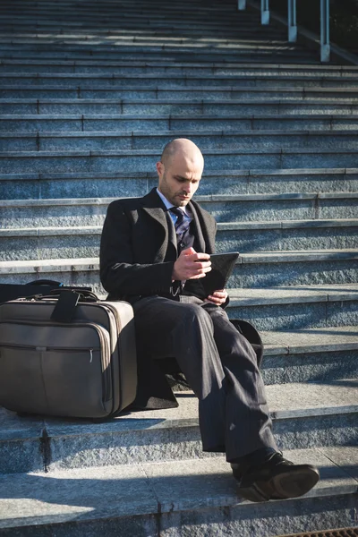 Successful elegant fashionable businessman using tablet — Stock Photo, Image