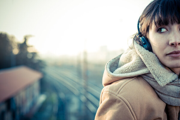 beautiful young woman listening to music headphones