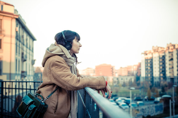 beautiful young woman listening to music headphones