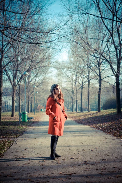 Beautiful woman red coat — Stock Photo, Image