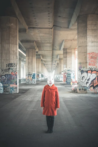 Rabbit mask woman red coat — Stock Photo, Image