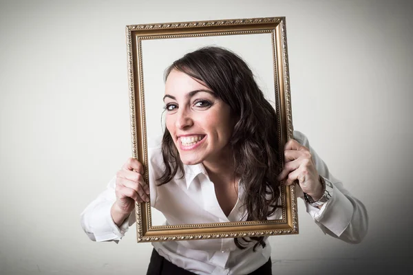 Beautiful young businesswoman through ledge — Stock Photo, Image