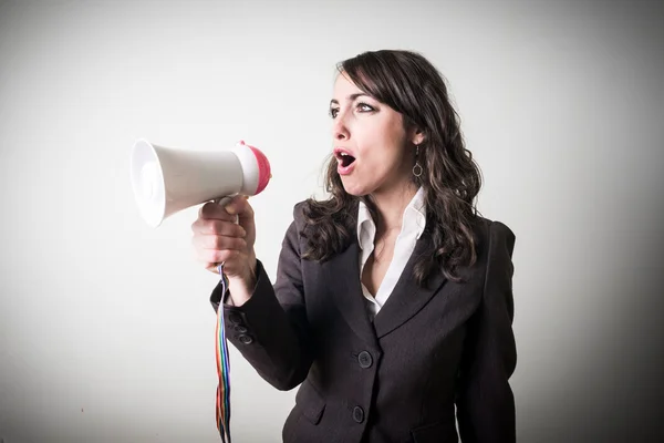 Beautiful young businesswoman with little megaphone — Stock Photo, Image