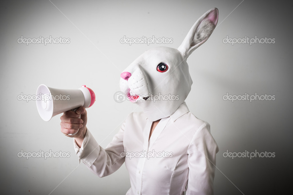beautiful young businesswoman mask rabbit megaphone