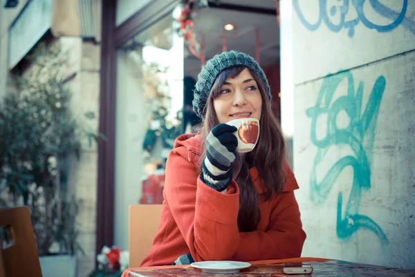 Beautiful woman red coat breakfast — Stock Photo, Image