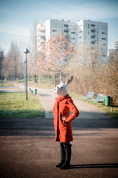 Rabbit mask woman red coat — Stock Photo, Image