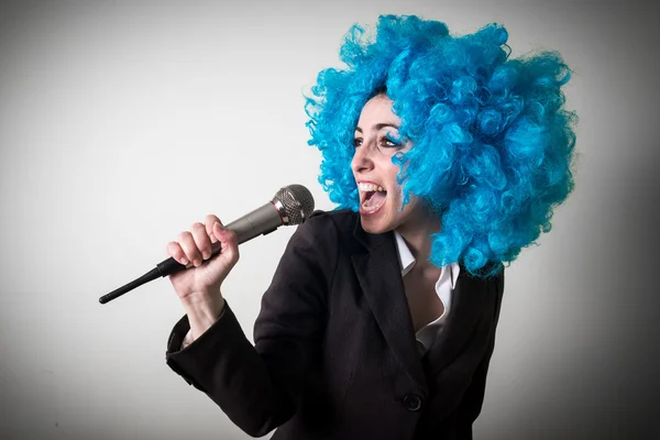 Funny blu wig beautiful young businesswoman — Stock Photo, Image