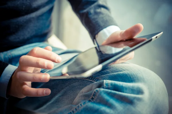 Close up hands multitasking man using tablet, laptop and cellhpo Stock Image