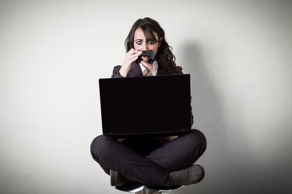 Beautiful young businesswoman using notebook — Stock Photo, Image