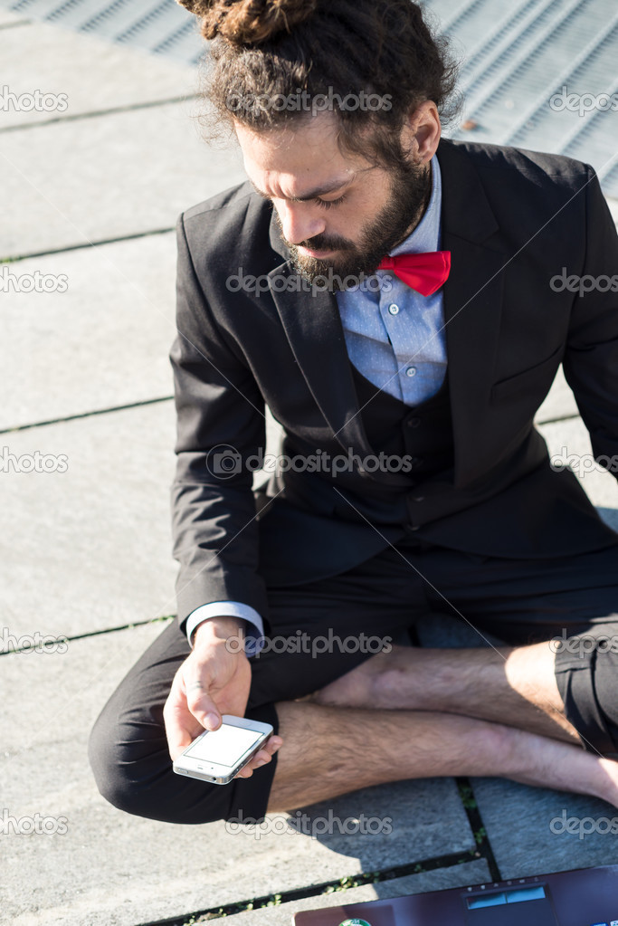 Stylish elegant dreadlocks businessman using notebook