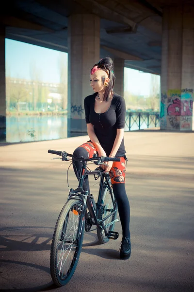 Punk girl riding bike — Stock Photo, Image