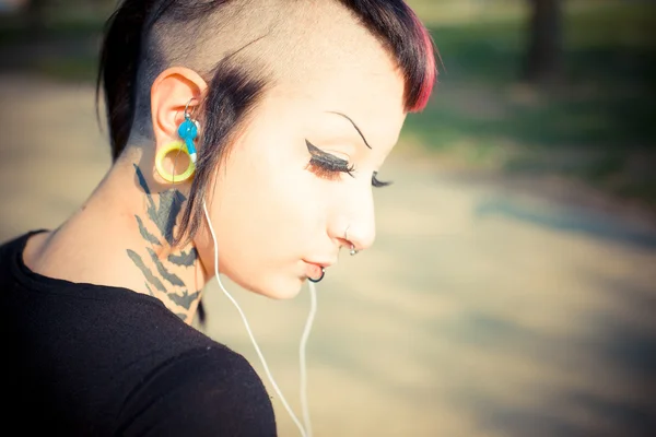 Punk girl listening music — Stock Photo, Image