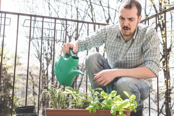 Handsome stylish man gardening