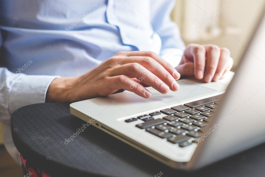 Hands using  laptop