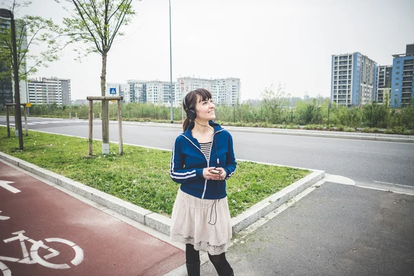 Beautiful woman in a desolate landscape — Stock Photo, Image