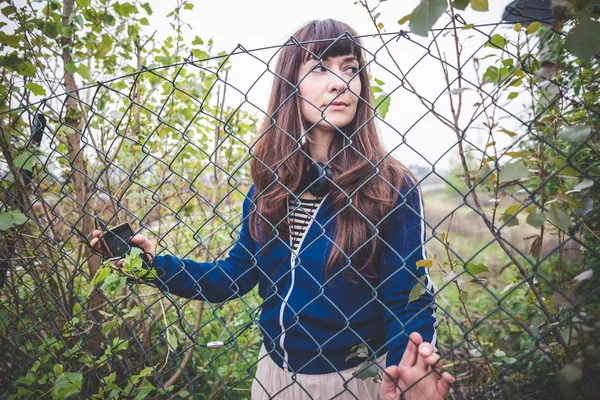 Beautiful woman in a desolate landscape — Stock Photo, Image