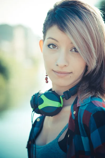 Young beautiful model woman listening music — Stock Photo, Image