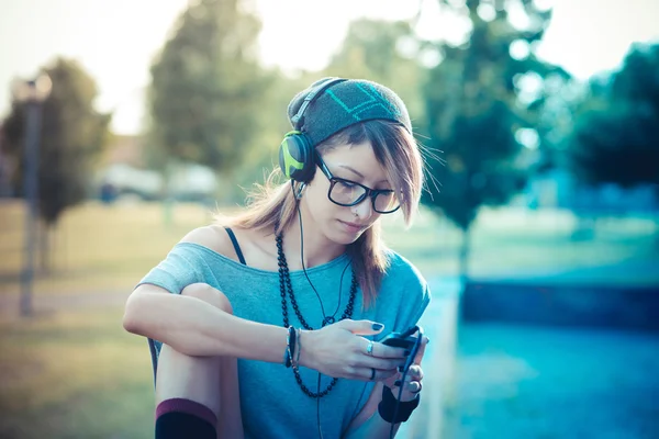 Young beautiful model woman listening music — Stock Photo, Image