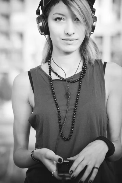 Young beautiful model woman listening music — Stock Photo, Image