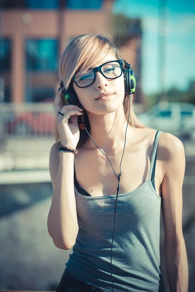 Young beautiful model woman listening music — Stock Photo, Image