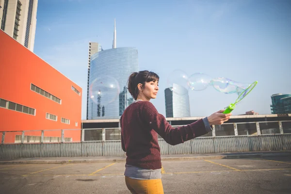 Woman with bubble blower — Stock Photo, Image