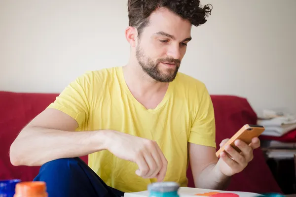 Handsome hipster modern man using cellphone — Stock Photo, Image