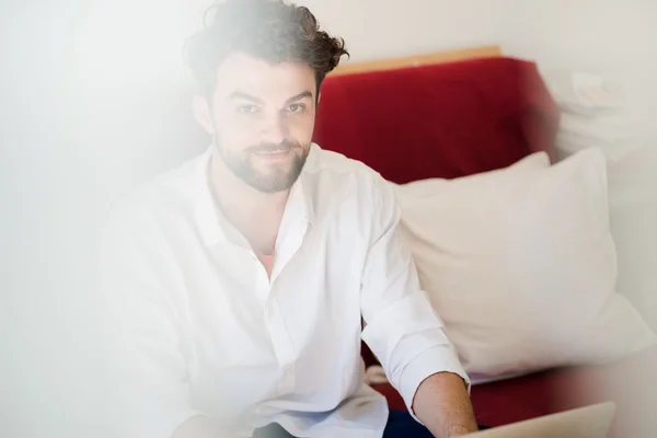 Handsome hipster modern man working home using laptop — Stock Photo, Image