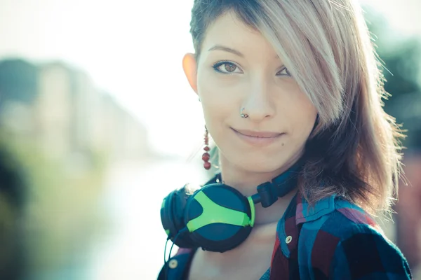 Young beautiful model woman listening music — Stock Photo, Image