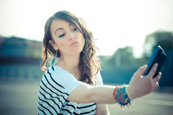 Young beautiful brunette woman selfie with smart phone — Stock Photo, Image