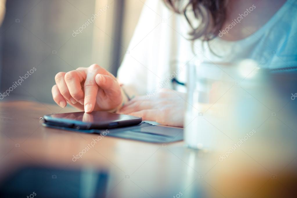 close up of woman hands using smart phone