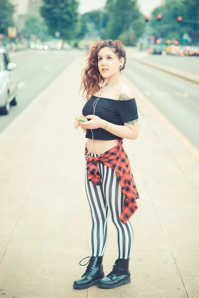 Curly hipster woman  listening music — Stock Photo, Image