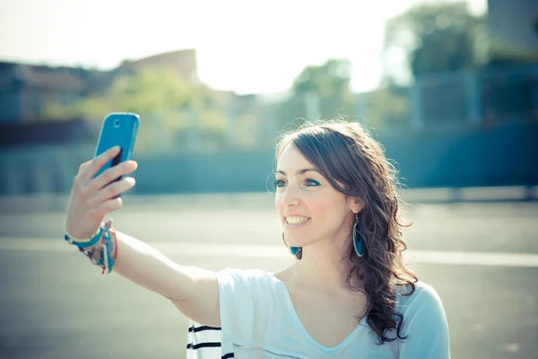 Young beautiful brunette woman selfie with smart phone — Stock Photo, Image