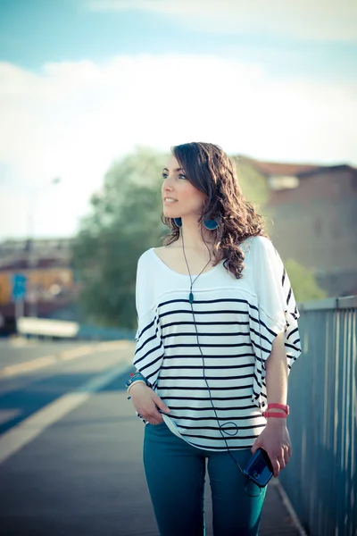 Young beautiful brunette woman with smart phone — Stock Photo, Image