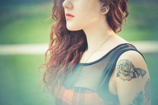 Young beautiful hipster woman with red curly hair — Stock Photo, Image