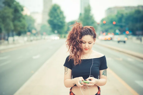 Young beautiful hipster woman with red curly hair — Stock Photo, Image