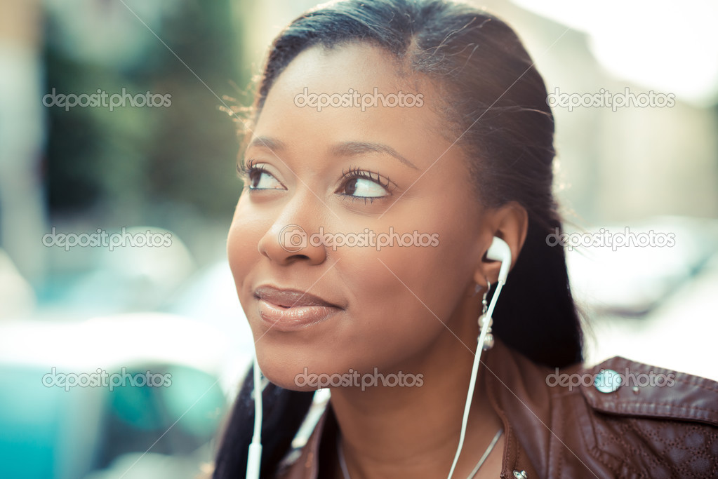 Woman listening music earphones