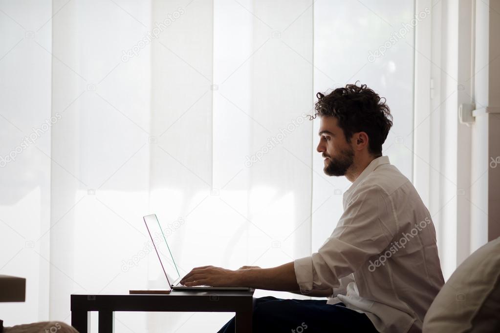 Man working home using laptop