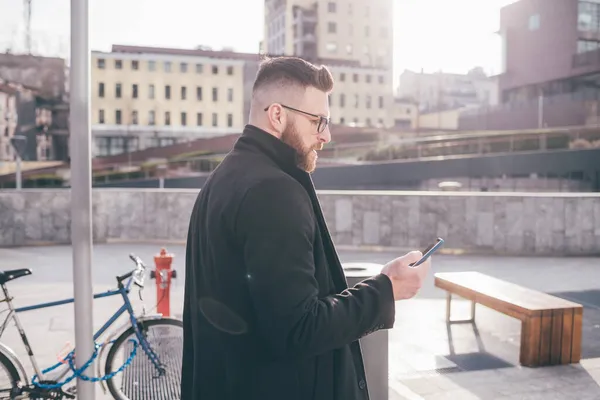 Young Handsome Caucasian Bearded Man Walking Outdoor Using Smartphone Watching — Stock Photo, Image